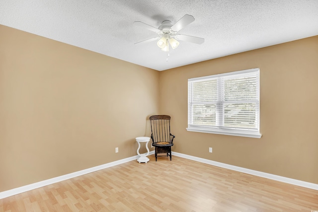 6634 Cinnamon Fern Ln, Myrtle Beach, SC 29588 - unfurnished room with a ceiling fan, light wood-style flooring, baseboards, and a textured ceiling