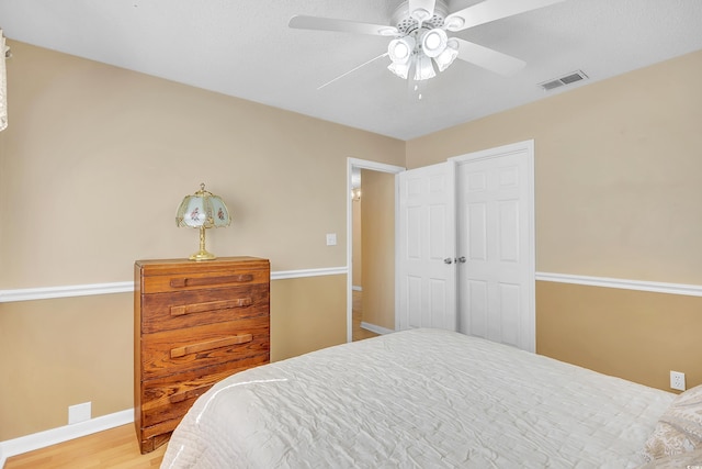 6634 Cinnamon Fern Ln, Myrtle Beach, SC 29588 - bedroom featuring visible vents, ceiling fan, baseboards, and wood finished floors