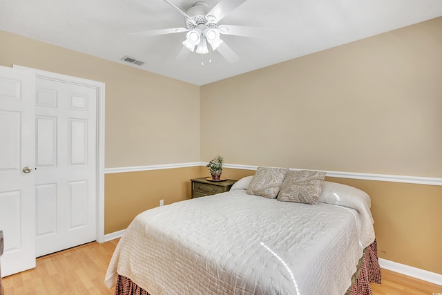 6634 Cinnamon Fern Ln, Myrtle Beach, SC 29588 - bedroom featuring a ceiling fan, wood finished floors, visible vents, and baseboards