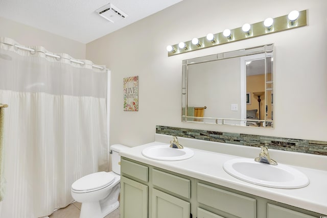 6634 Cinnamon Fern Ln, Myrtle Beach, SC 29588 - bathroom with double vanity, visible vents, toilet, and a sink