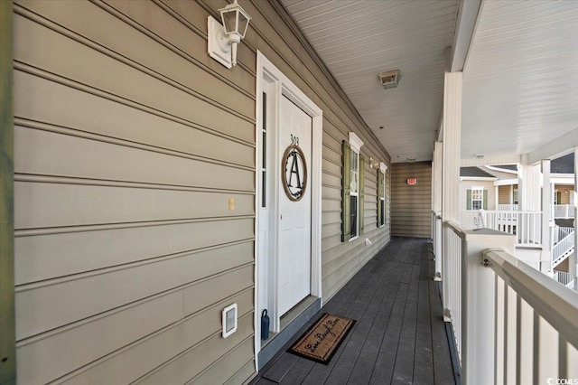 wooden terrace with a porch