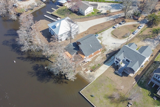 bird's eye view with a water view and a residential view