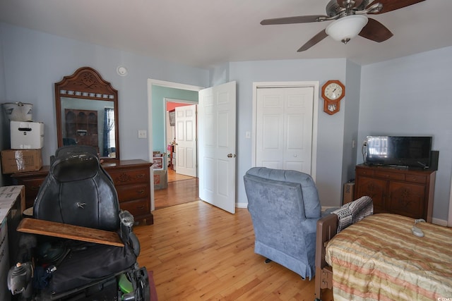 home office featuring ceiling fan, baseboards, and light wood-style flooring