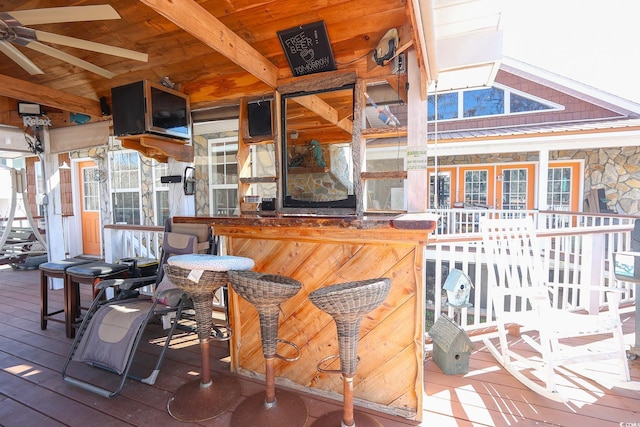 wooden terrace featuring outdoor dry bar