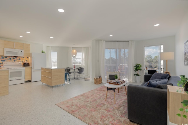 living area with recessed lighting