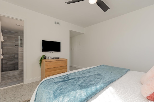 bedroom with ceiling fan, speckled floor, visible vents, and baseboards