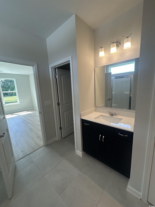 360 Kapalua Loop, Little River, SC 29566 - bathroom with vanity, tile patterned flooring, and baseboards