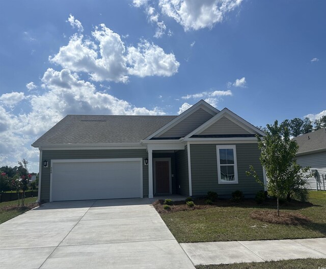 360 Kapalua Loop, Little River, SC 29566 - ranch-style home featuring driveway, an attached garage, and a front yard