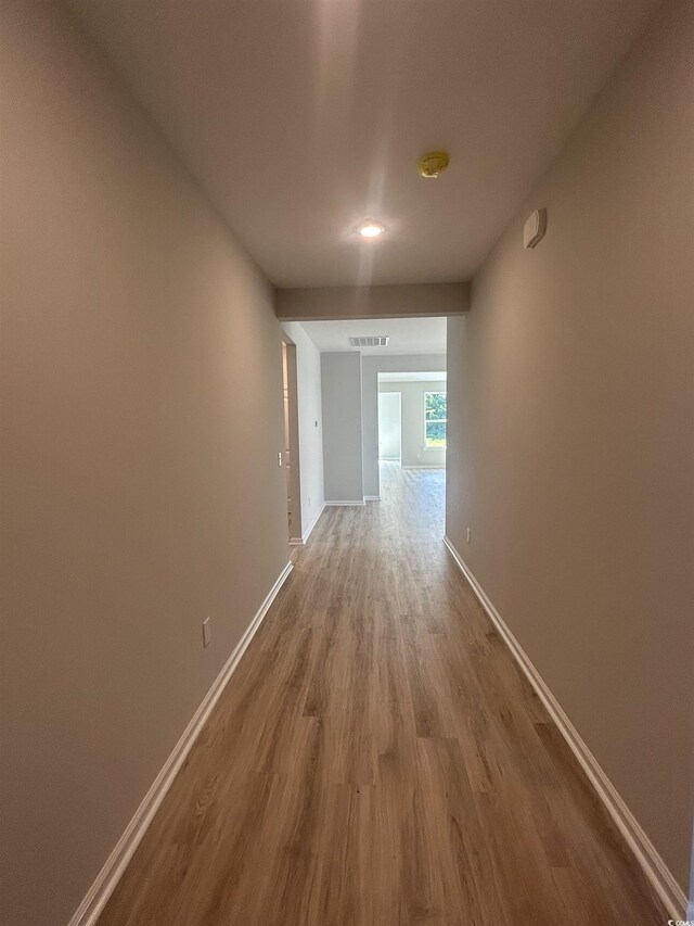 360 Kapalua Loop, Little River, SC 29566 - hall featuring wood finished floors and baseboards