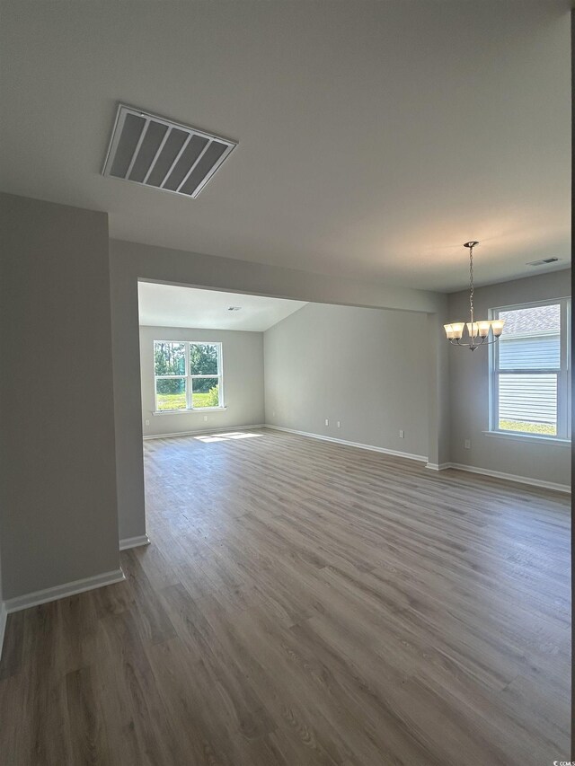 360 Kapalua Loop, Little River, SC 29566 - unfurnished room featuring a chandelier, wood finished floors, and baseboards
