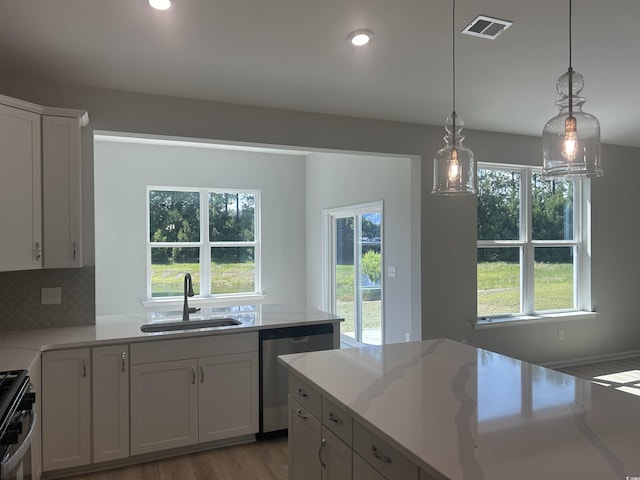 360 Kapalua Loop, Little River, SC 29566 - kitchen featuring stainless steel appliances, a sink, plenty of natural light, white cabinets, and recessed lighting