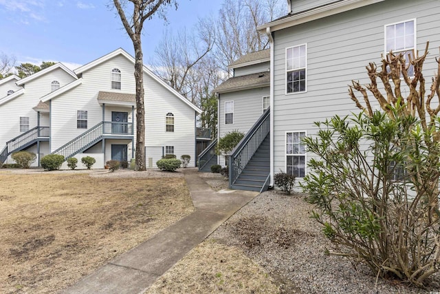 view of side of home with stairs