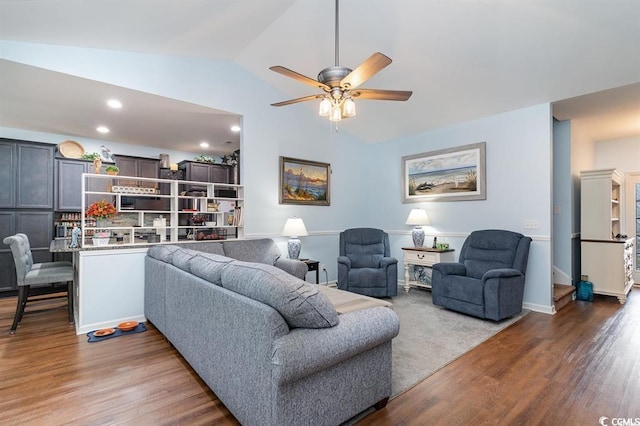 living room with a ceiling fan, lofted ceiling, recessed lighting, and wood finished floors