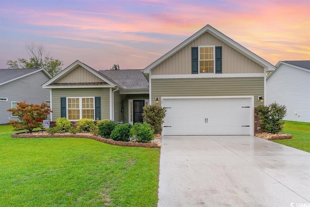 view of front of property with a garage, a shingled roof, concrete driveway, board and batten siding, and a front yard