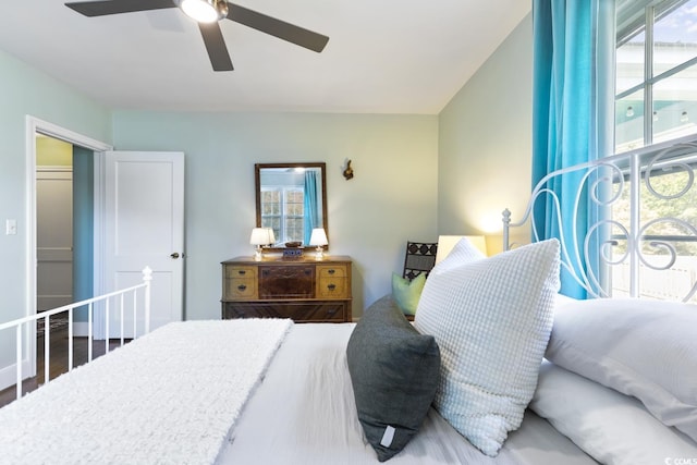 bedroom featuring wood finished floors and a ceiling fan