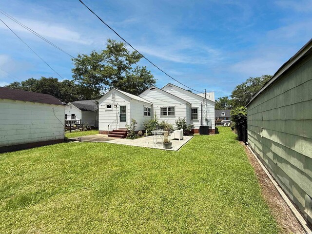 632 Magnolia Dr, Georgetown, SC 29440 - back of house featuring a yard and a patio