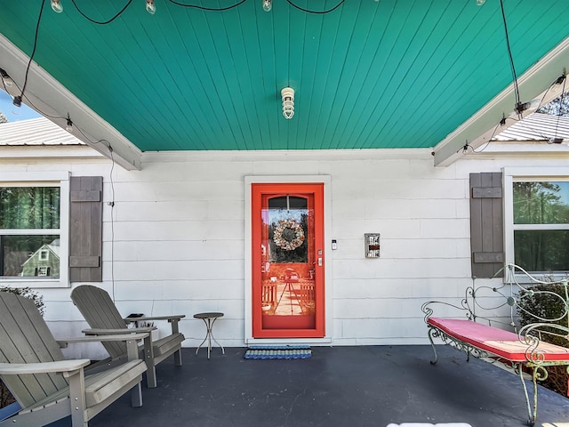 view of exterior entry with metal roof