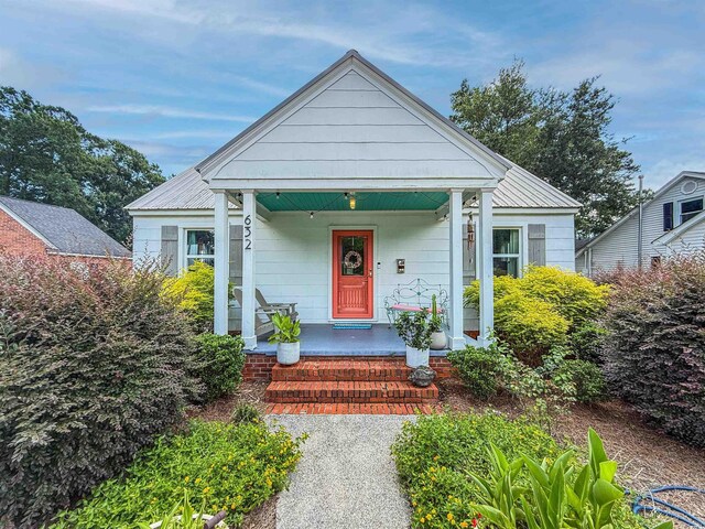 632 Magnolia Dr, Georgetown, SC 29440 - bungalow-style house with a porch and a metal roof