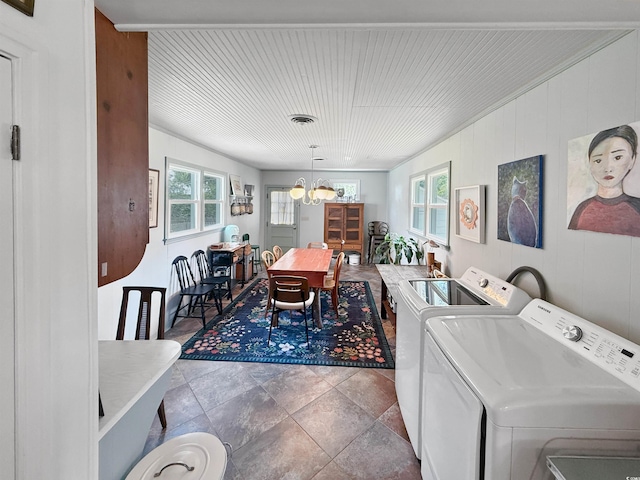 632 Magnolia Dr, Georgetown, SC 29440 - laundry area with a chandelier, washer and dryer, stone finish flooring, and ornamental molding