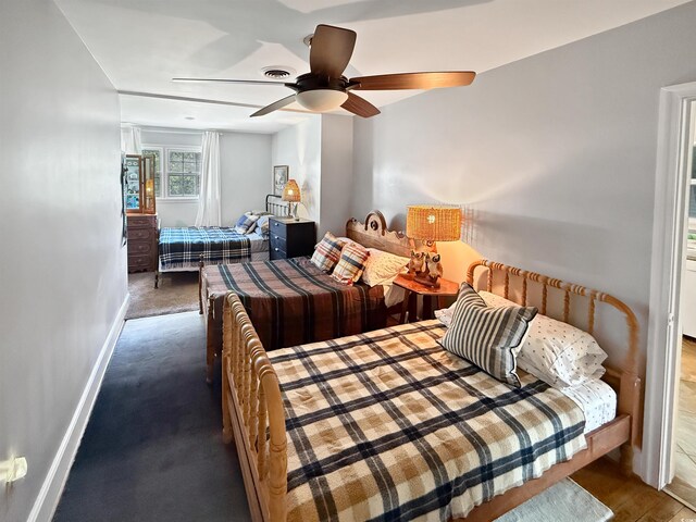 632 Magnolia Dr, Georgetown, SC 29440 - carpeted bedroom featuring baseboards and ceiling fan