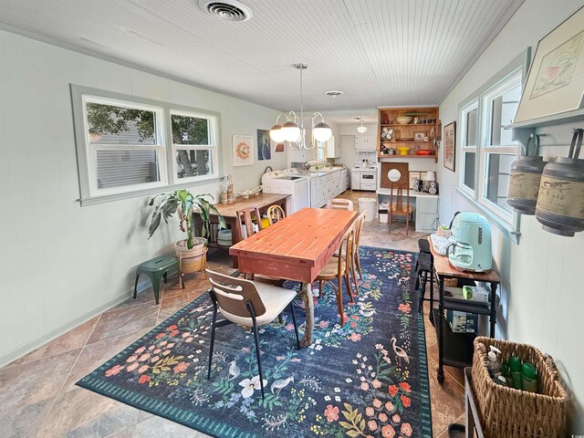 632 Magnolia Dr, Georgetown, SC 29440 - dining room with a chandelier and baseboards