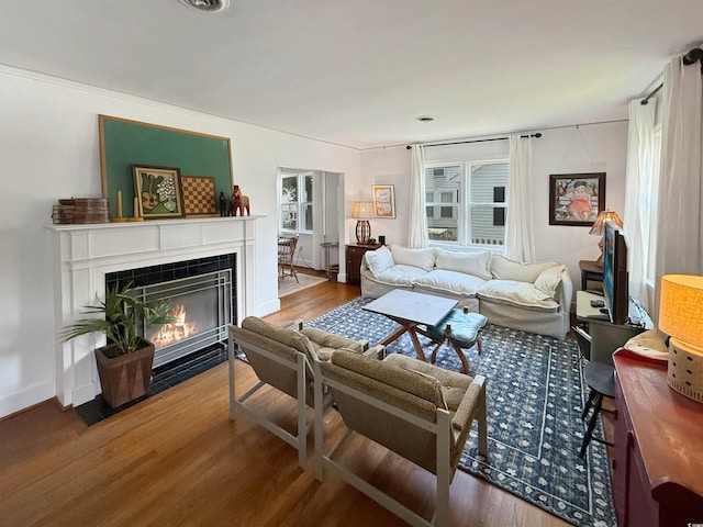632 Magnolia Dr, Georgetown, SC 29440 - living room featuring wood finished floors and a tiled fireplace