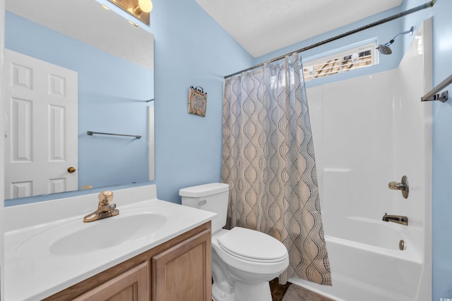 bathroom featuring toilet, shower / tub combo with curtain, and vanity