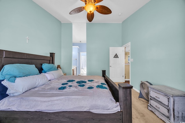 bedroom featuring baseboards, light carpet, and a ceiling fan