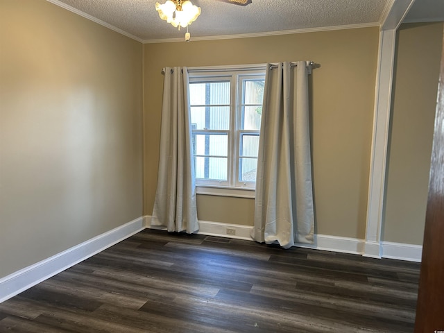 empty room featuring dark wood-style floors, baseboards, and a textured ceiling