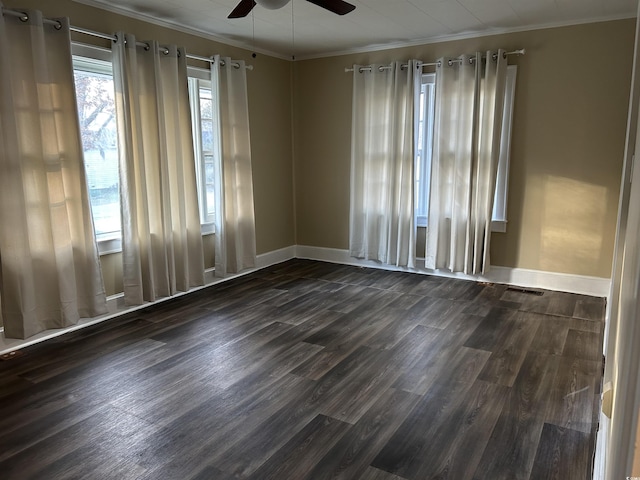 unfurnished room with dark wood-style flooring, baseboards, a ceiling fan, and ornamental molding