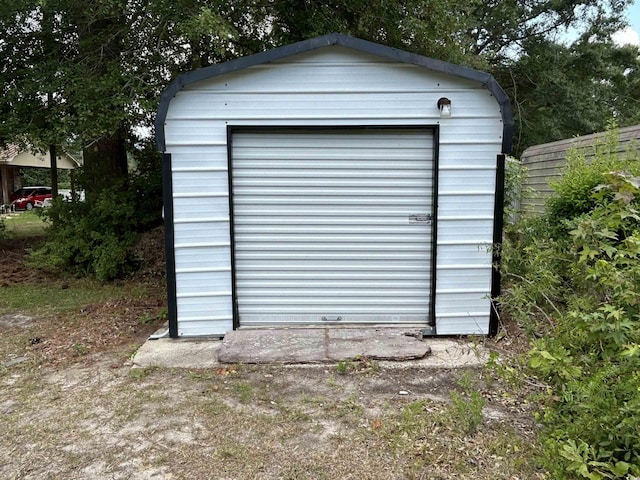 view of shed with fence