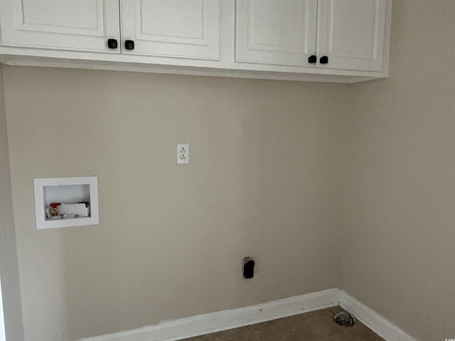 laundry room featuring hookup for a washing machine, cabinet space, and baseboards