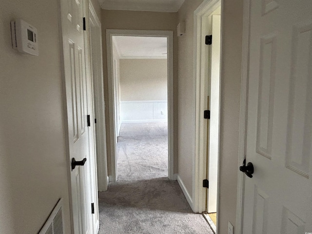 hall with light carpet and visible vents