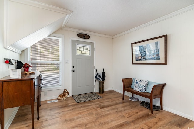 613 Calhoun Dr, Murrells Inlet, SC 29576 - foyer featuring light wood finished floors, ornamental molding, and baseboards