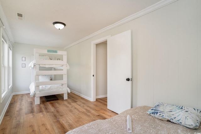 613 Calhoun Dr, Murrells Inlet, SC 29576 - bedroom with light wood-style flooring, baseboards, and crown molding