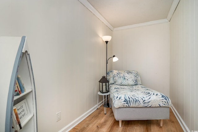 613 Calhoun Dr, Murrells Inlet, SC 29576 - bedroom featuring light wood-style floors, ornamental molding, baseboards, and a decorative wall