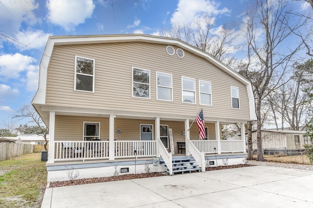 613 Calhoun Dr, Murrells Inlet, SC 29576 - dutch colonial featuring covered porch, a gambrel roof, central AC unit, and crawl space