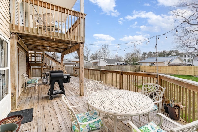 613 Calhoun Dr, Murrells Inlet, SC 29576 - deck featuring a fenced backyard, stairway, and outdoor dining space