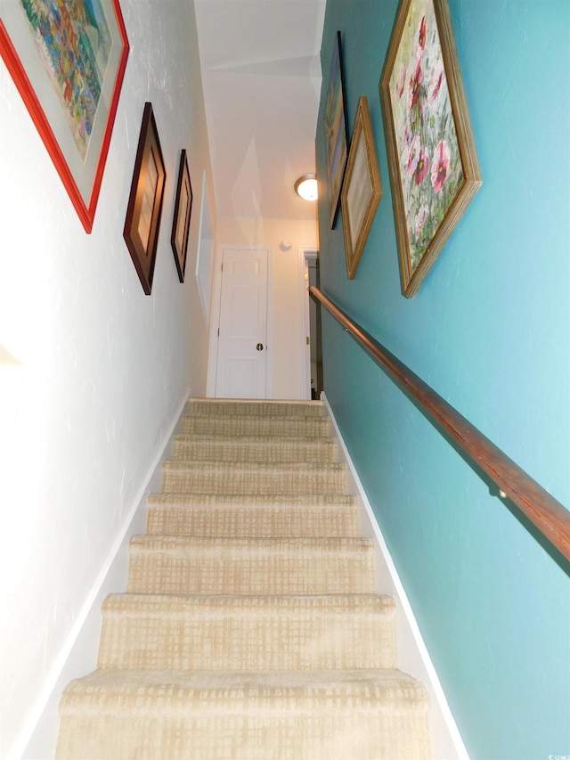 stairway with baseboards