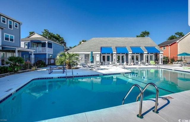 pool featuring a patio and fence