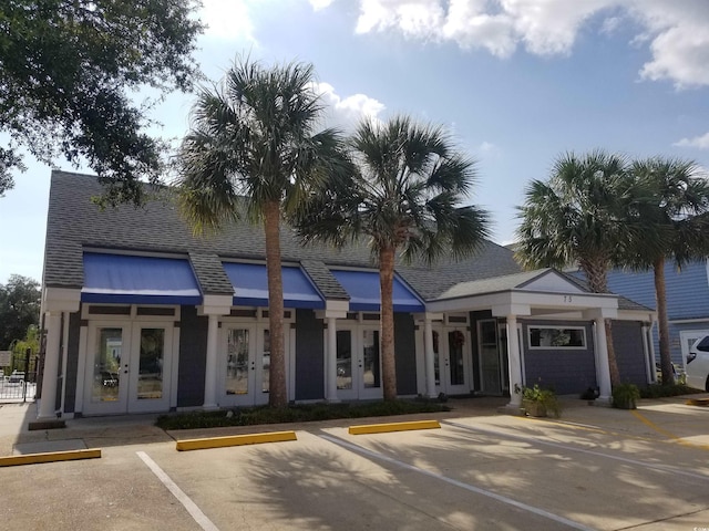 view of building exterior featuring uncovered parking