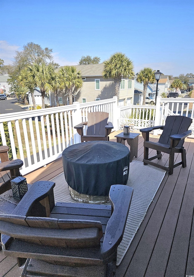 wooden terrace featuring a residential view