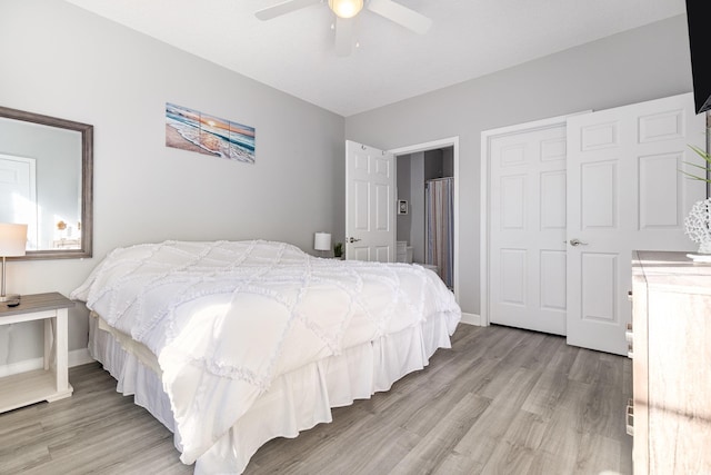 bedroom featuring light wood-style flooring, baseboards, and ceiling fan