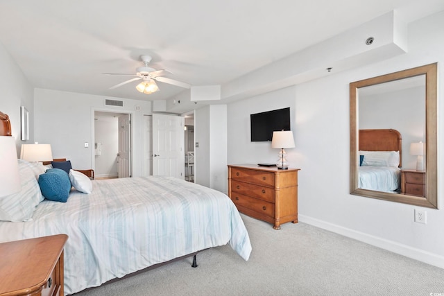 bedroom featuring light colored carpet, visible vents, ceiling fan, and baseboards