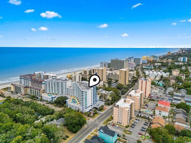 birds eye view of property featuring a water view and a city view