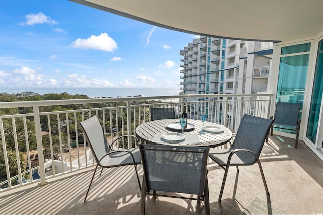 balcony featuring a water view