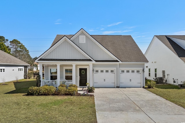 view of front facade featuring a porch, board and batten siding, a garage, driveway, and a front lawn