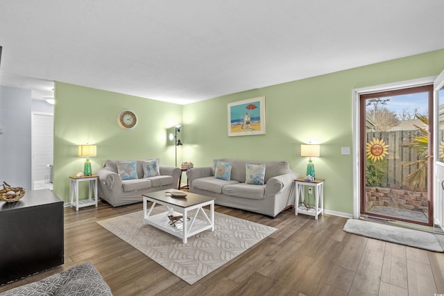 living room with wood finished floors and baseboards