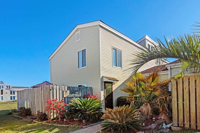 view of property exterior with fence