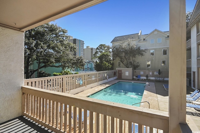 view of swimming pool with a patio